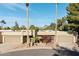 Tan two-story home with a double garage and nicely landscaped front yard at 9015 N 86Th Pl, Scottsdale, AZ 85258