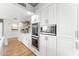 Modern kitchen with white cabinets, double ovens, and stainless steel appliances at 9015 N 86Th Pl, Scottsdale, AZ 85258