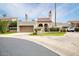 Single-level home with a two-car garage and well-manicured lawn at 9709 E Mountain View Rd # 1609, Scottsdale, AZ 85258