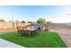 Backyard with patio furniture and artificial grass at 10049 E Boise St, Mesa, AZ 85207