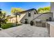 Landscaped backyard with outdoor kitchen, basketball hoop, and artificial turf at 10191 E Diamond Rim Dr # 2122, Scottsdale, AZ 85255