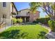 Landscaped backyard with putting green and spacious lawn at 10191 E Diamond Rim Dr # 2122, Scottsdale, AZ 85255