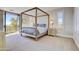Main bedroom with four-poster bed and balcony access at 10191 E Diamond Rim Dr # 2122, Scottsdale, AZ 85255