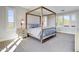 Main bedroom with four-poster bed and window seating at 10191 E Diamond Rim Dr # 2122, Scottsdale, AZ 85255