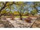 Community courtyard with seating areas, fountain, and mature trees at 10191 E Diamond Rim Dr # 2122, Scottsdale, AZ 85255