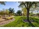 Scenic community park with lush landscaping, shaded seating areas, and open green space at 10191 E Diamond Rim Dr # 2122, Scottsdale, AZ 85255