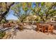 Relaxing community patio with seating, fountain, and shade trees at 10191 E Diamond Rim Dr # 2122, Scottsdale, AZ 85255