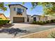 Two-story home with attached garage, driveway, and landscaping at 10191 E Diamond Rim Dr # 2122, Scottsdale, AZ 85255