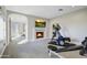 Home gym with elliptical, weights, and fireplace at 10191 E Diamond Rim Dr # 2122, Scottsdale, AZ 85255