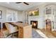 Bright home office features built-in desk, fireplace, and hardwood floors at 10191 E Diamond Rim Dr # 2122, Scottsdale, AZ 85255
