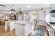 Spacious kitchen with a large island, marble countertops, and modern lighting at 10191 E Diamond Rim Dr # 2122, Scottsdale, AZ 85255
