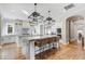 Gourmet kitchen with island, stainless steel appliances, and white cabinetry at 10191 E Diamond Rim Dr # 2122, Scottsdale, AZ 85255