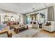 Open living room featuring a comfortable seating area and access to a patio at 10191 E Diamond Rim Dr # 2122, Scottsdale, AZ 85255