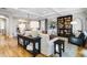 Living room with hardwood floors, built-in shelving, and comfortable seating at 10191 E Diamond Rim Dr # 2122, Scottsdale, AZ 85255