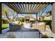 Relaxing outdoor seating area with fire pit under pergola at 10191 E Diamond Rim Dr # 2122, Scottsdale, AZ 85255