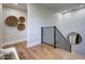 Light and airy upstairs hallway with hardwood floors at 10191 E Diamond Rim Dr # 2122, Scottsdale, AZ 85255