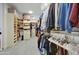 Spacious walk-in closet with ample shelving and hanging space at 10191 E Diamond Rim Dr # 2122, Scottsdale, AZ 85255