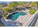 Freeform swimming pool with large patio area at 10532 E Firewheel Dr, Scottsdale, AZ 85255