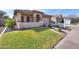 Landscaped front yard with curb appeal and a two-car garage at 11543 E Starkey Ave, Mesa, AZ 85212