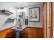 Simple bathroom with pedestal sink, wood accents, and framed art at 1310 W Marshall Ave, Phoenix, AZ 85013