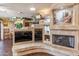 Living room boasts a fireplace, built-in shelving and a large TV at 1310 W Marshall Ave, Phoenix, AZ 85013