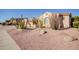 Landscaped front yard with desert landscaping and large cacti at 13204 W Palo Verde Dr, Litchfield Park, AZ 85340