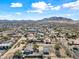 Aerial view showcasing a house, pool, and surrounding desert landscape at 1739 W Joy Ranch Rd, Phoenix, AZ 85086