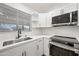 Modern kitchen with stainless steel appliances and white shaker cabinets at 1739 W Joy Ranch Rd, Phoenix, AZ 85086