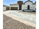 Luxury home exterior with a circular driveway and desert landscaping at 1809 E Gwen St, Phoenix, AZ 85042