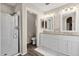 Clean bathroom with double sinks, granite countertop and shower at 18110 N Skyhawk Dr, Surprise, AZ 85374