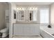 Elegant bathroom with double vanity, soaking tub, and separate toilet at 18110 N Skyhawk Dr, Surprise, AZ 85374