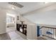 A well-lit hallway with built-in shelving and a view into a bedroom at 18110 N Skyhawk Dr, Surprise, AZ 85374