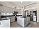 Well-equipped kitchen with gray cabinets, granite countertops, and stainless steel appliances at 18110 N Skyhawk Dr, Surprise, AZ 85374