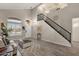 Spacious living room with high ceilings, hardwood floors, and staircase at 18110 N Skyhawk Dr, Surprise, AZ 85374
