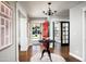 Bright and airy entryway with hardwood floors and a statement red door at 1838 Palmcroft Nw Way, Phoenix, AZ 85007