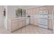 Bright kitchen with light wood cabinets and white appliances at 18637 E Amarado Cir, Rio Verde, AZ 85263