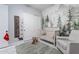 Bedroom featuring a crib, rocking horse, and mountain mural at 20201 S 229Th Way, Queen Creek, AZ 85142