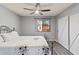 Bedroom featuring a ceiling fan and backyard view at 2138 E Williams Dr, Phoenix, AZ 85024