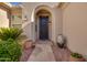 Front entry with a security door and terracotta pots at 22033 N Arrellaga Dr, Sun City West, AZ 85375