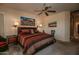 King-size bed in Primary bedroom with southwestern decor and window shutters at 22033 N Arrellaga Dr, Sun City West, AZ 85375