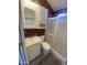 Updated bathroom with a shower/tub combo and white vanity at 2205 W Klamath Ave, Apache Junction, AZ 85119