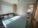 Bedroom with a double bed, ceiling fan and built-in wooden cabinets at 2205 W Klamath Ave, Apache Junction, AZ 85119