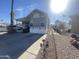 Mobile home exterior with carport and landscaping at 2205 W Klamath Ave, Apache Junction, AZ 85119