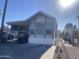 Mobile home exterior with carport and landscaping at 2205 W Klamath Ave, Apache Junction, AZ 85119
