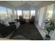 Bright living room with two red leather recliners and large windows at 2205 W Klamath Ave, Apache Junction, AZ 85119