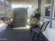 Covered patio with seating area and storage shed at 2205 W Klamath Ave, Apache Junction, AZ 85119