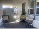 Covered patio with seating area and storage shed at 2205 W Klamath Ave, Apache Junction, AZ 85119