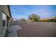 Backyard with a paved patio and gravel area, perfect for relaxing at 22325 N 185Th Ave, Surprise, AZ 85387