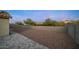 Large backyard with a gravel area and paved patio at 22325 N 185Th Ave, Surprise, AZ 85387