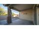 Covered patio with stone flooring and backyard access at 22325 N 185Th Ave, Surprise, AZ 85387